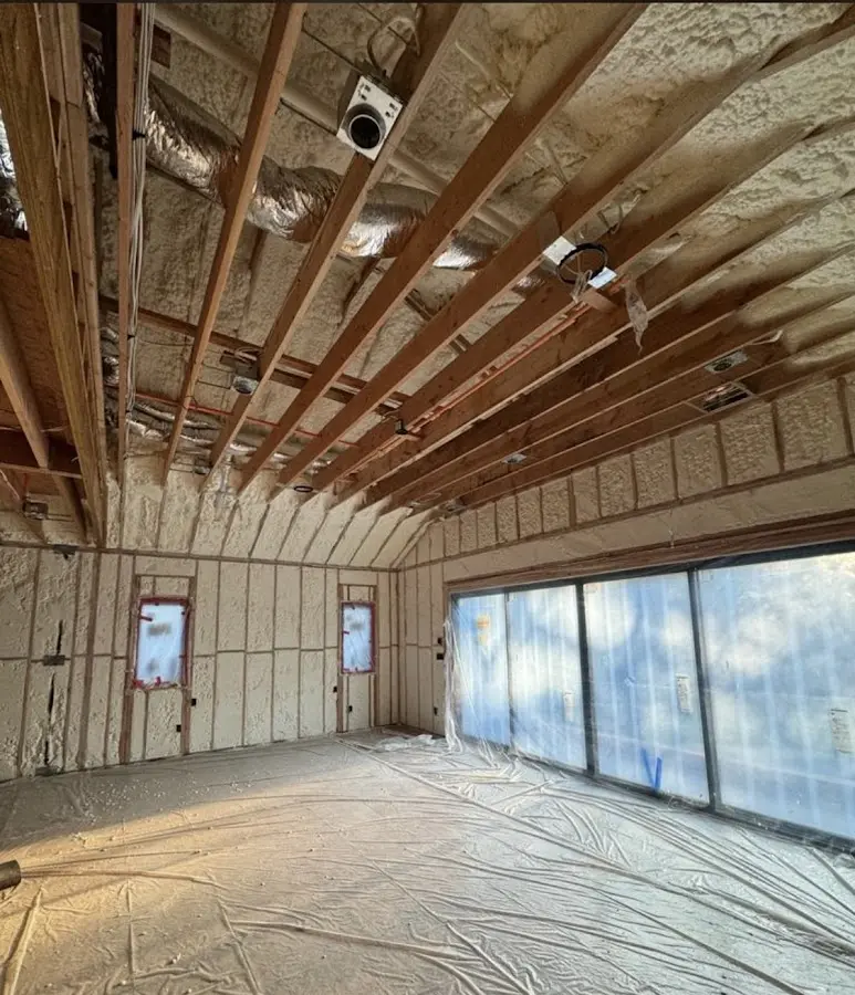 Interior walls and ceiling insulated with spray foam during new construction in Birch Run